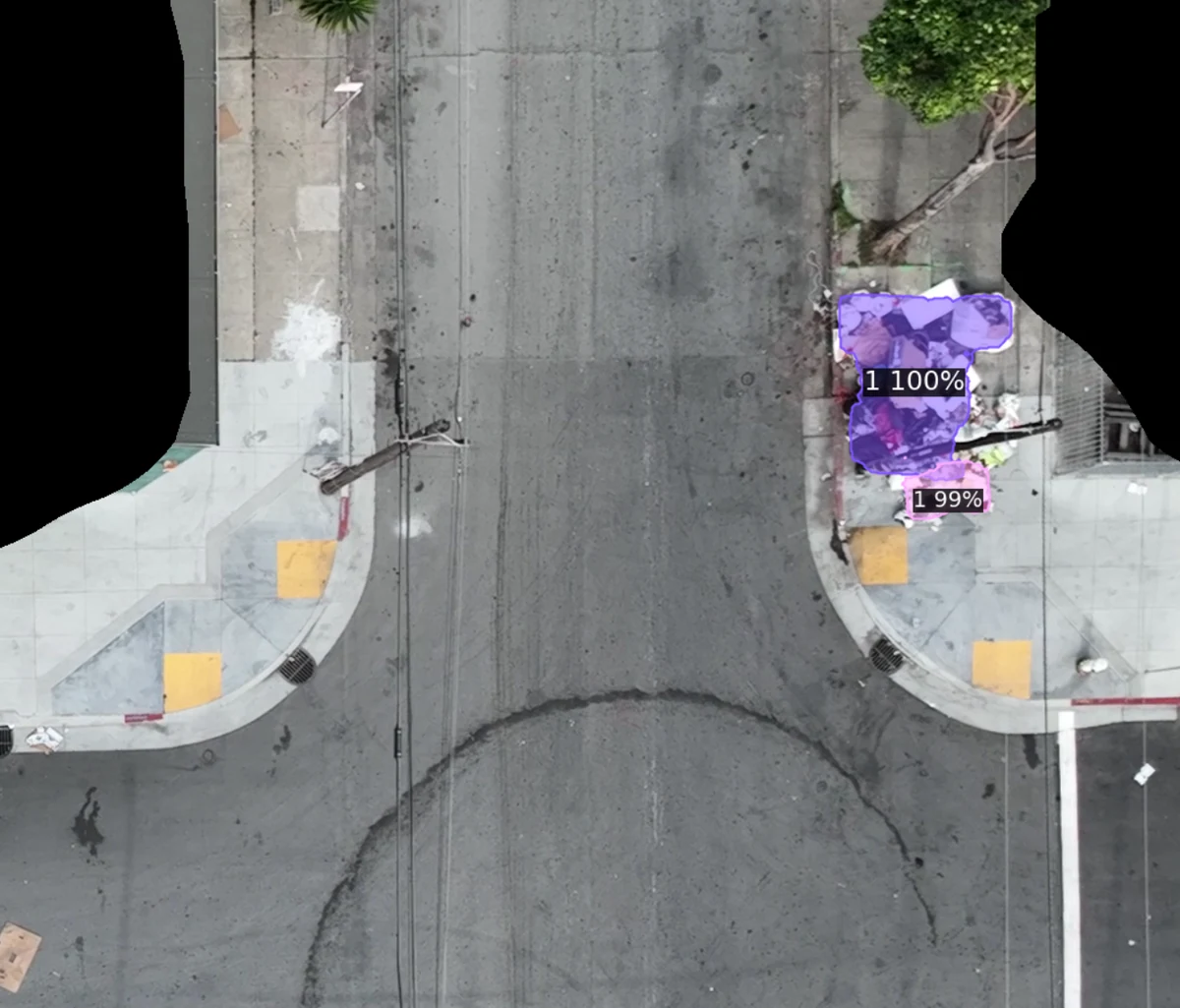 Close aerial view of a garbage pile on a sidewalk with a purple segmentation mask and 99-100% confidence labels